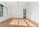 Spacious dining room featuring hardwood floors and a modern chandelier at 2899 Treeside Terrace, Marietta, GA 30066