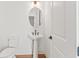 Elegant powder room with pedestal sink and toilet at 2899 Treeside Terrace, Marietta, GA 30066