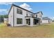 Two story home with covered patio and grassy backyard at 2899 Treeside Terrace, Marietta, GA 30066