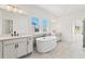 Elegant bathroom featuring a free-standing bathtub and double vanity at 2899 Treeside Terrace, Marietta, GA 30066