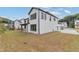Spacious backyard with grassy lawn and modern home exterior at 2899 Treeside Terrace, Marietta, GA 30066