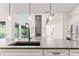 Modern kitchen with white cabinets, large island, and stainless steel appliances at 2899 Treeside Terrace, Marietta, GA 30066