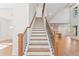Elegant staircase with dark wood railing and white risers at 2899 Treeside Terrace, Marietta, GA 30066