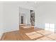 Sun-drenched living room with hardwood floors and views to staircase at 2899 Treeside Terrace, Marietta, GA 30066