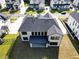 Aerial view of a house showcasing its roofline, backyard, and surrounding neighborhood at 2899 Treeside Terrace, Marietta, GA 30066