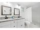 Updated bathroom with double vanity and marble shower at 2581 Hood Nw Ave, Atlanta, GA 30318