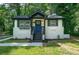 Charming white brick ranch home with a blue door at 2581 Hood Nw Ave, Atlanta, GA 30318