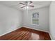 Bedroom with hardwood floors, ceiling fan, and large window at 3384 Brookside Ln, Jonesboro, GA 30236