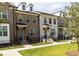 Beautiful row of townhomes with well-manicured lawns at 630 Skytop Dr # 157, Cumming, GA 30040