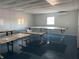 Interior of a large room with multiple workbenches at 6225 Collins Nw Rd, Acworth, GA 30101