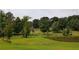 Farmland with pond and trees at 6225 Collins Nw Rd, Acworth, GA 30101