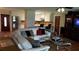 Living Room with hardwood floors, white sofa and a view into the kitchen at 6225 Collins Nw Rd, Acworth, GA 30101