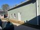 Detached garage with green siding and additional storage space at 6225 Collins Nw Rd, Acworth, GA 30101