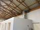 Unfinished interior with exposed beams, a water heater, and potential for expansion at 6225 Collins Nw Rd, Acworth, GA 30101