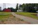 Aerial view of property with two barns and a long driveway at 6225 Collins Nw Rd, Acworth, GA 30101
