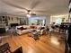 Large living room with hardwood floors, sectional sofa, and fireplace at 6225 Collins Nw Rd, Acworth, GA 30101