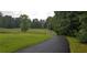 Long paved driveway leading to property at 6225 Collins Nw Rd, Acworth, GA 30101
