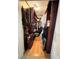 Large walk-in closet with ample storage space and wood shelving at 6225 Collins Nw Rd, Acworth, GA 30101