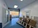 Interior with roll-up door, boxes, and ladder at 6225 Collins Nw Rd, Acworth, GA 30101