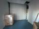 Interior of a storage room with a roll-up door at 6225 Collins Nw Rd, Acworth, GA 30101