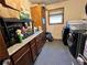 Laundry room with washer, dryer, and additional storage at 6225 Collins Nw Rd, Acworth, GA 30101