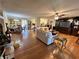 Open concept living area with hardwood floors and views into kitchen and dining areas at 6225 Collins Nw Rd, Acworth, GA 30101
