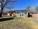 Brick home with attached shed and yard at 6225 Collins Nw Rd, Acworth, GA 30101