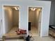 Two small, unfinished bathrooms with toilets and sinks at 6225 Collins Nw Rd, Acworth, GA 30101