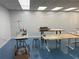 Bright interior room with sewing machines and workbenches at 6225 Collins Nw Rd, Acworth, GA 30101