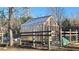 Spacious greenhouse nestled in a fenced backyard garden at 6225 Collins Nw Rd, Acworth, GA 30101