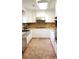 Renovated kitchen with white cabinets and granite at 6225 Collins Nw Rd, Acworth, GA 30101