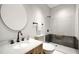 Modern bathroom with a walk-in shower, updated vanity, and stylish fixtures at 1070 Dill Sw Ave, Atlanta, GA 30310