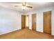 Bedroom with two closets and brown carpet at 2802 Leisure Woods Ln, Decatur, GA 30034