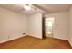 Bright bedroom with golden carpet and door to bathroom at 2802 Leisure Woods Ln, Decatur, GA 30034