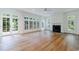 Living room with hardwood floors, plantation shutters, and fireplace at 1632 Brookhaven Close Ne, Brookhaven, GA 30319