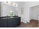 Elegant bathroom with dark vanity, double sinks, and walk-in shower at 108 Park Place Unit 314, Decatur, GA 30030