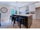 Modern kitchen with large island and white shaker cabinets at 160 Rose Creek Dr, Covington, GA 30014