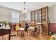 Dining room with hardwood floors, wood hutch, and a table at 5833 Wind Haven Nw Ct, Kennesaw, GA 30152