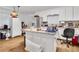 Kitchen features an island, white cabinets, and stainless steel appliances at 5833 Wind Haven Nw Ct, Kennesaw, GA 30152