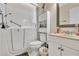 Accessible bathroom with walk-in tub, toilet, and vanity at 5833 Wind Haven Nw Ct, Kennesaw, GA 30152