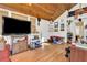 Bright sunroom office with wood ceiling, hardwood floors, and built-in shelving at 5833 Wind Haven Nw Ct, Kennesaw, GA 30152