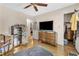 Bedroom with hardwood floors, ceiling fan and walk-in closet at 5833 Wind Haven Nw Ct, Kennesaw, GA 30152