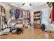 Bedroom with wood floors, large closet, and seating area at 5833 Wind Haven Nw Ct, Kennesaw, GA 30152