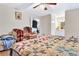 Large bedroom with hardwood floors, ceiling fan, and access to bathroom at 5833 Wind Haven Nw Ct, Kennesaw, GA 30152