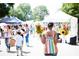Personal carrying sunflowers at a bustling farmers market at 2280 Park Walke Dr, Alpharetta, GA 30009