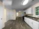 Open kitchen with white cabinets and tile floors at 4024 Waldrop Hills Dr, Decatur, GA 30034