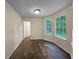 Bright bedroom featuring wood-look floors and an adjacent door at 4024 Waldrop Hills Dr, Decatur, GA 30034