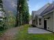 House backyard with patio and wooded area at 4024 Waldrop Hills Dr, Decatur, GA 30034