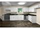 Bright kitchen with white cabinets and dark countertops at 4024 Waldrop Hills Dr, Decatur, GA 30034