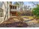 Landscaped yard with stone path and mulch beds at 3672 Howell Wood Nw Trl, Duluth, GA 30096